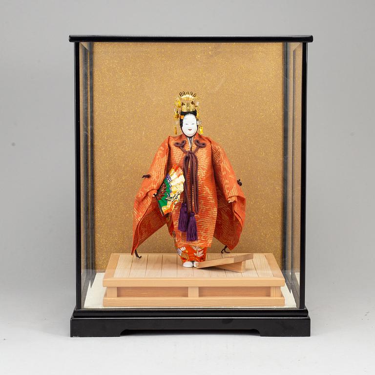 A Japanese doll from the 20th century.