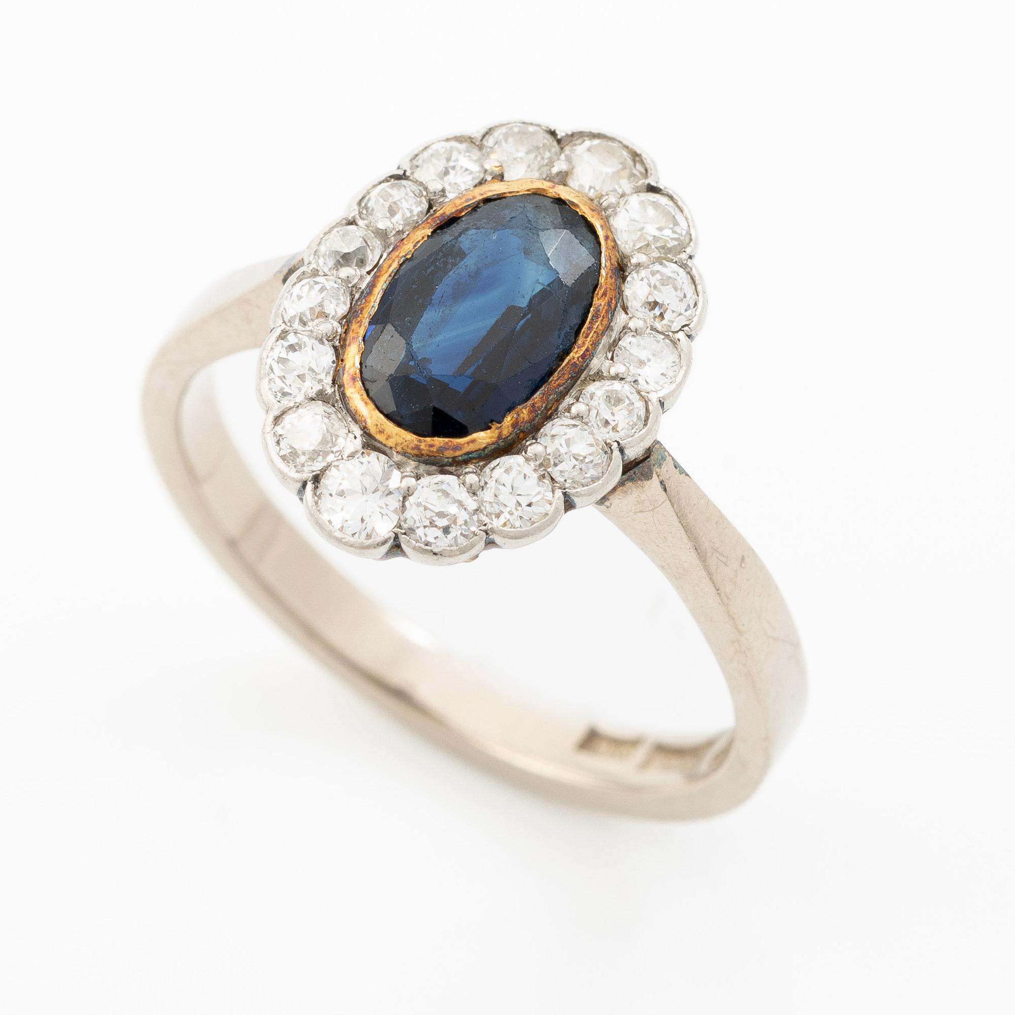 Ring, camrose model, 18K white gold with sapphire and old-cut diamonds.