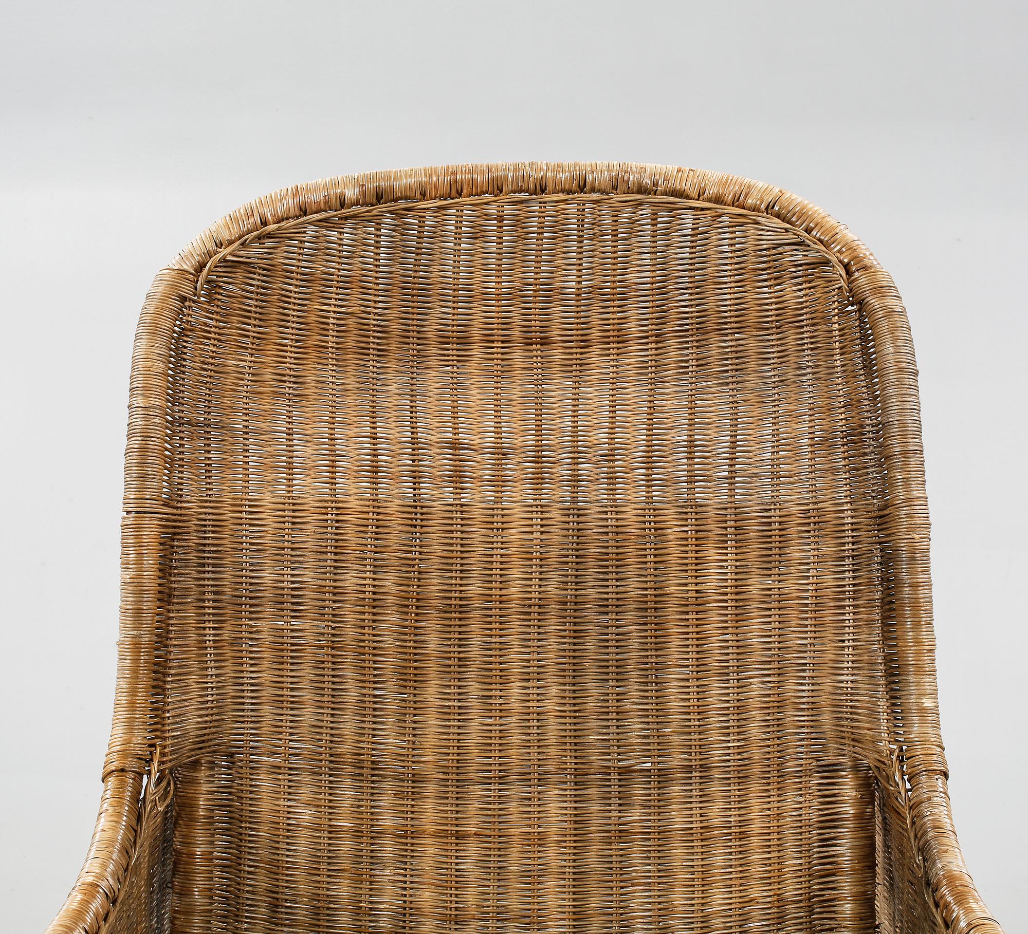A rattan arm chair from the second half of the 20th century.