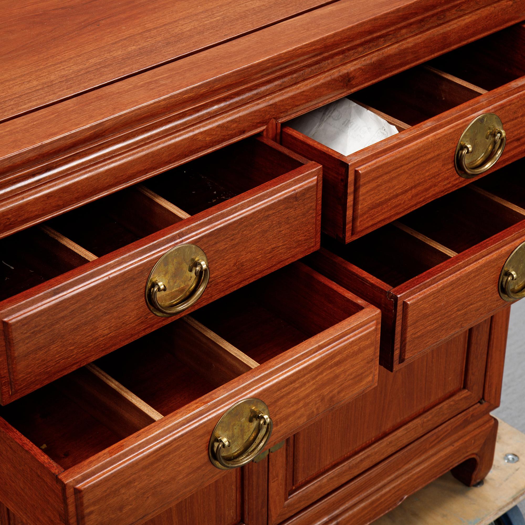 A pair of cupboards or sideboards, Yuen Cheong Furniture Co, Hong Kong, second half of the 20th century.