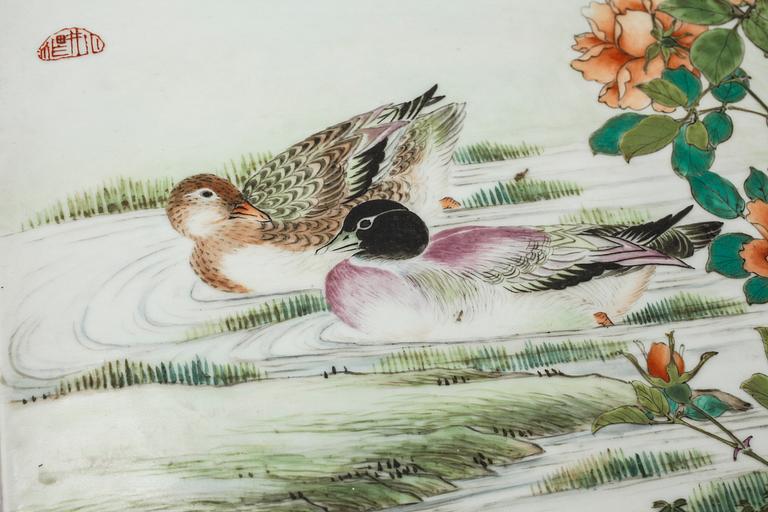 Two Chinese porcelain tiles from the 20th century.