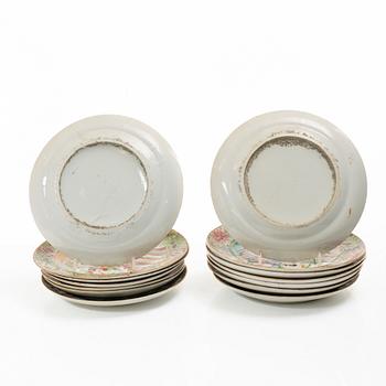 A matched set of 14 famille rose 'Canton' dinner plates, Qing dynasty, 19th century.