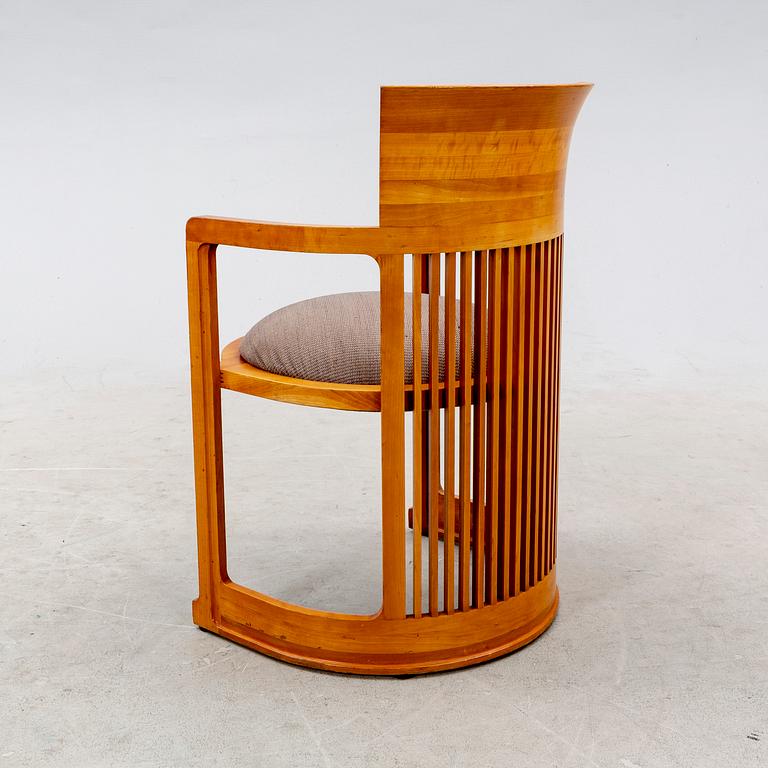 A cherry wood model 606 'Barrel' chair by Frank Lloyd Wright from Cassina.