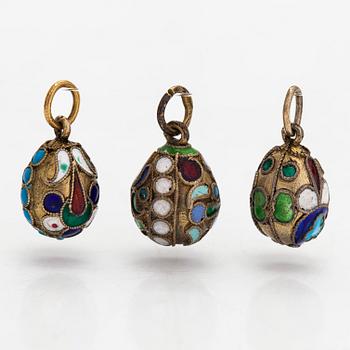 A collection of 24 egg pendants in original wooden box, Russia, early 20th century.