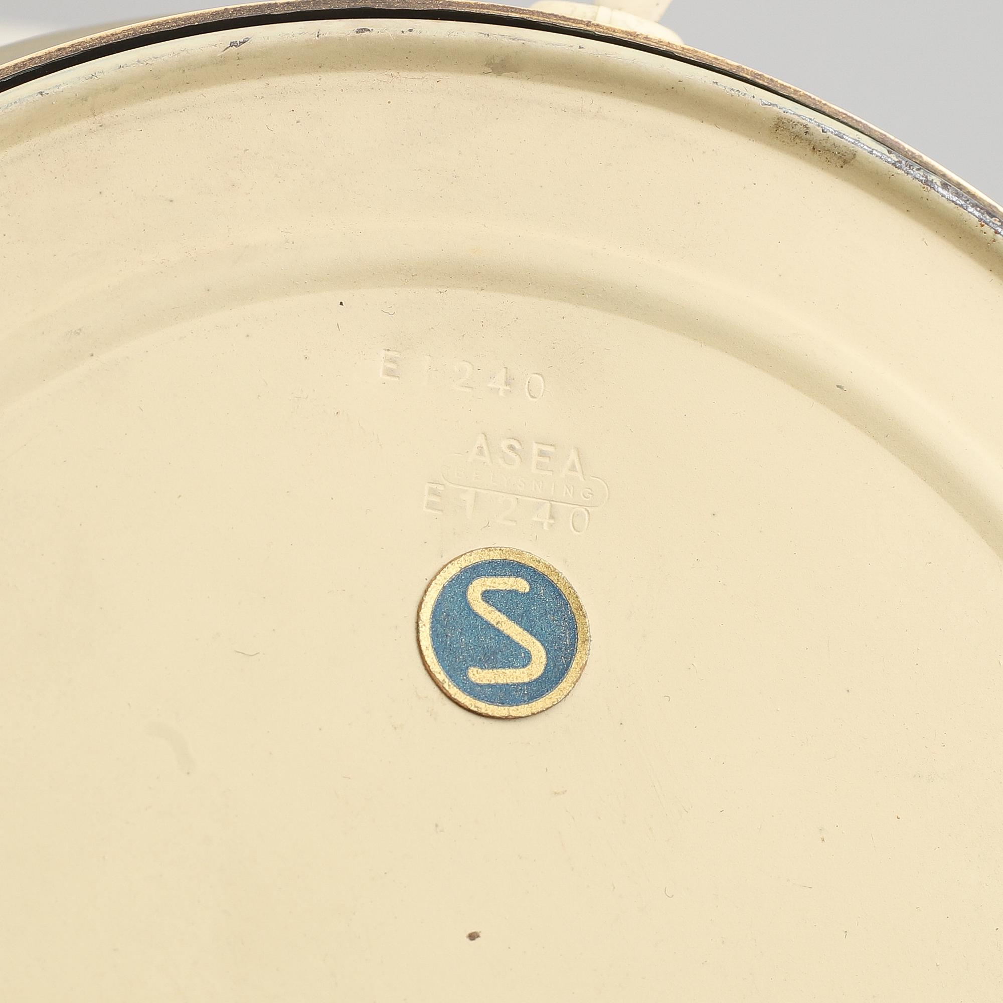 A brass and oak table light by Hans Bergström for ASEA, mid 20th Century.