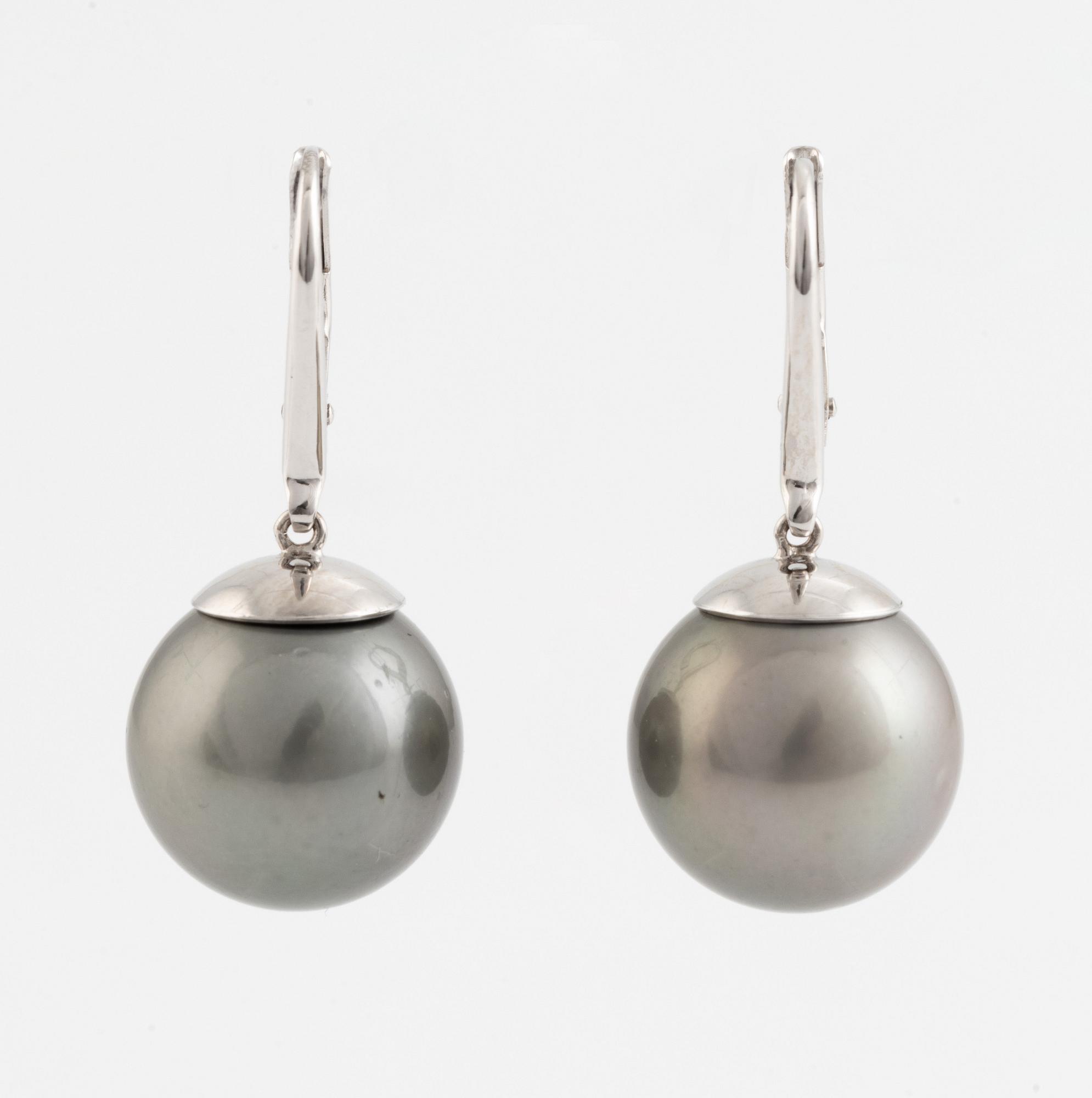 Cultured Tahiti pearl earrings.