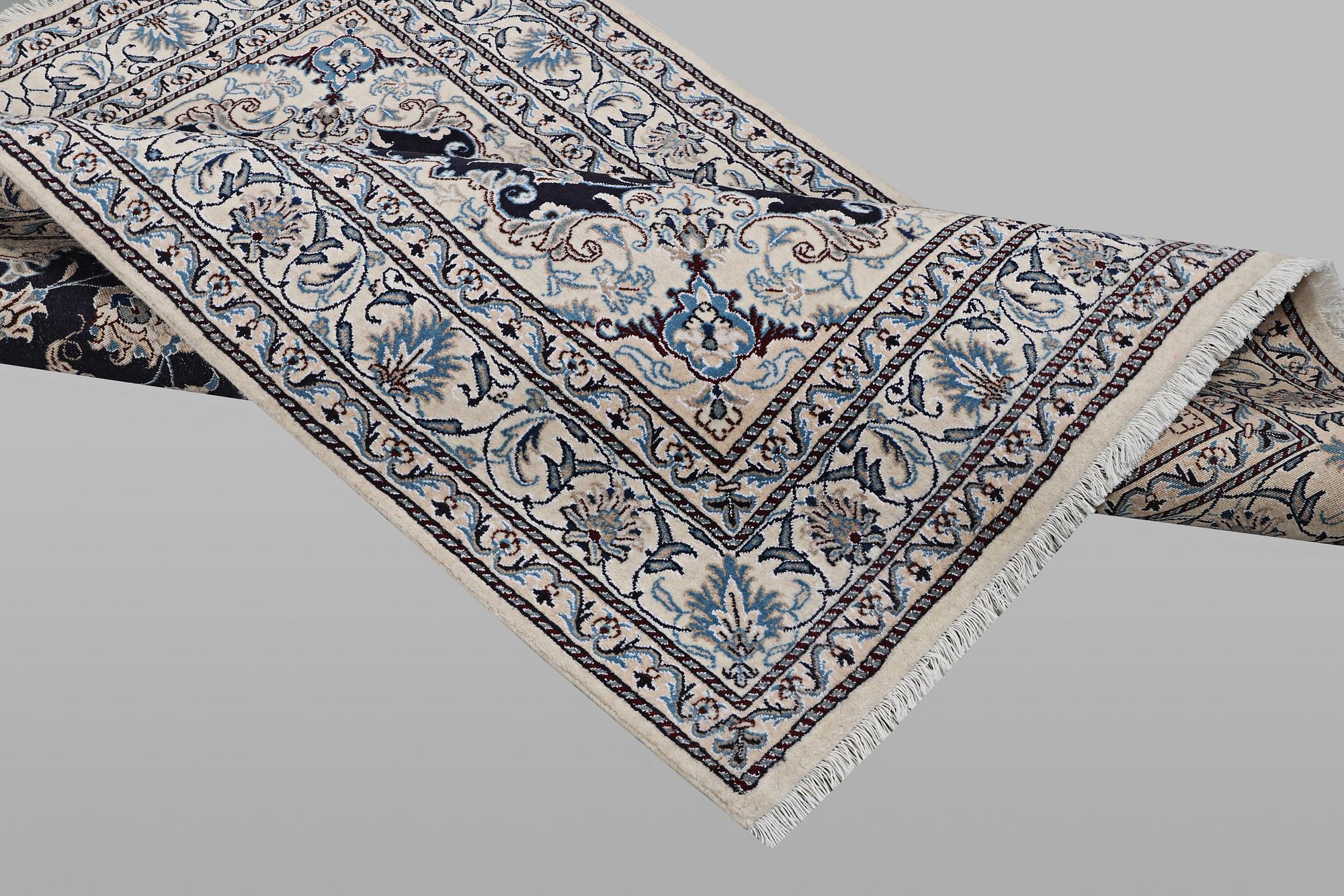 A rug, Nain, part silk, ca 198 x 144 cm.
