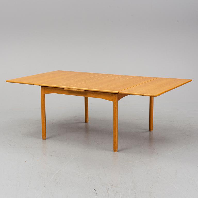 A Norwegian table, Heggen, 1950s-60s. Four leg extenders included.