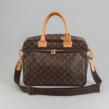 Louis Vuitton, a monogram canvas carry on bag.