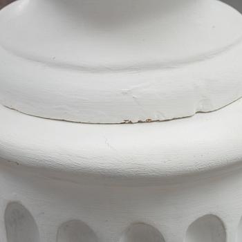 A plaster bust and pedestal.