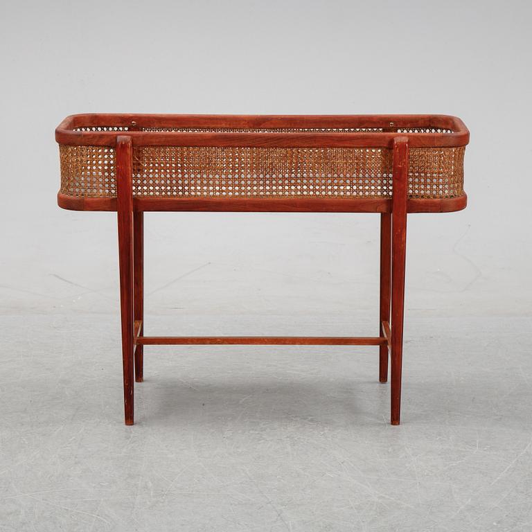 A flowertable with rattan details, late 20th century.