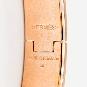 Hermès, a 'Clic H' bracelet.