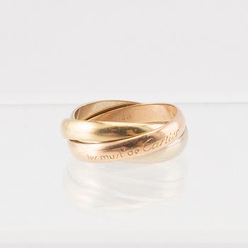 An 18K tri-coloured "Trinity" gold ring by Cartier.