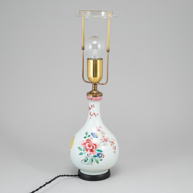 A famille rose bottle vase, Qing dynasty, 18th Century. Mounted as a lamp.