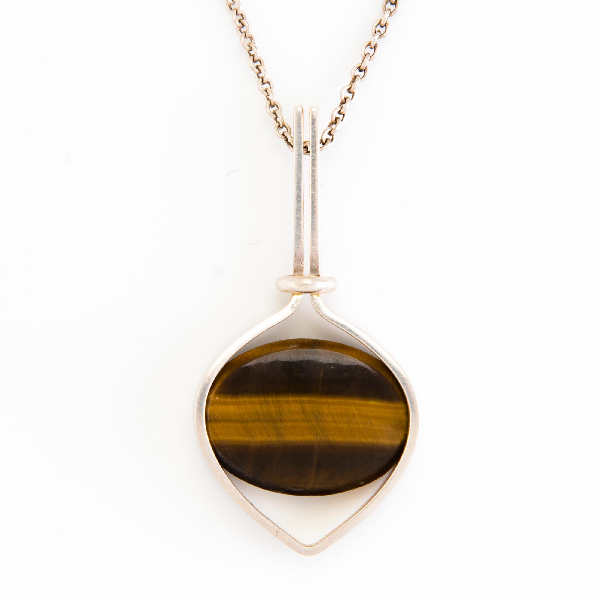 RIIPUS ja SORMUS, hopeaa, tiikerinsilmä, 1961.