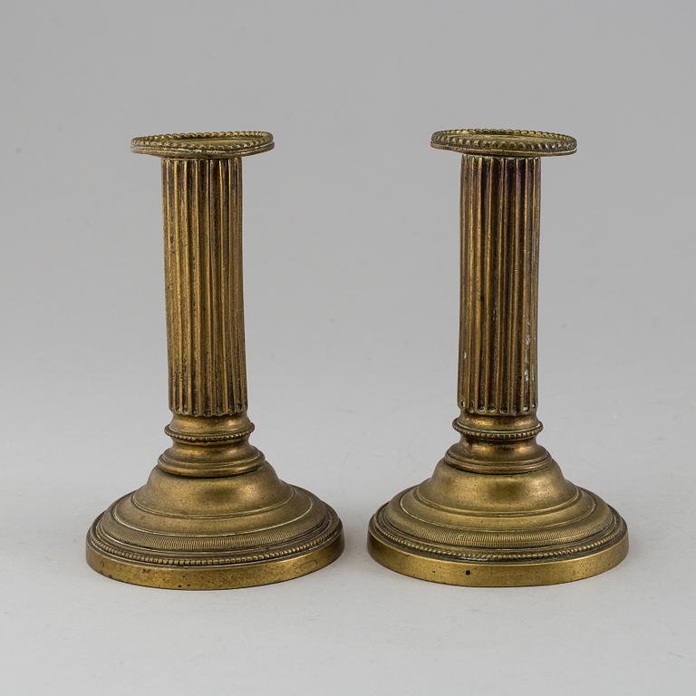 A PAIR OF GUSTAVIAN BRONZE CANDLESTICKS, latter part of the 18th century.