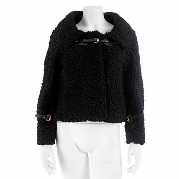 473. GUCCI, a black persian lamb jacket, size 40.