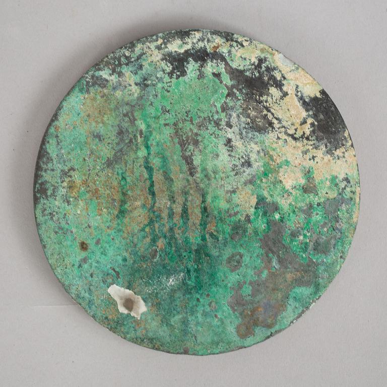 A broze mirror, presumably Tang dynasty (618-907 A.D.).