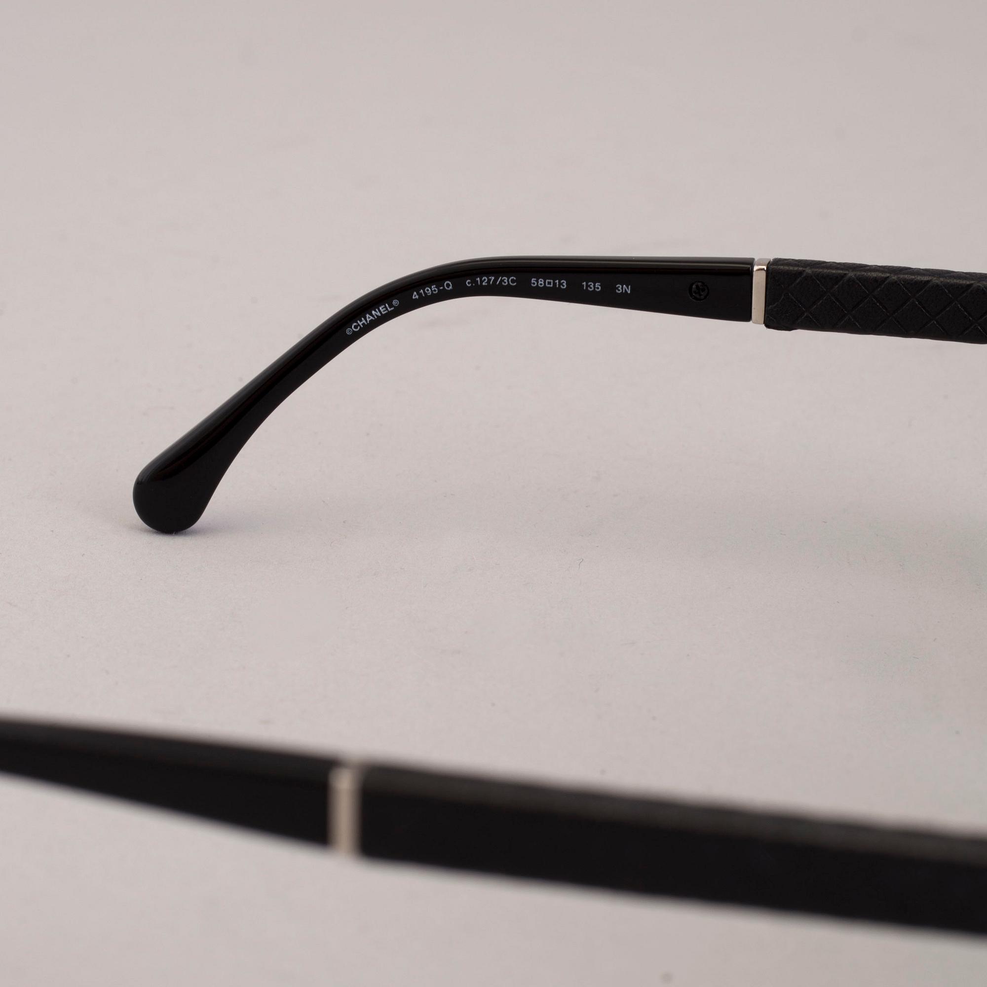 Chanel black pilot summer glasses.