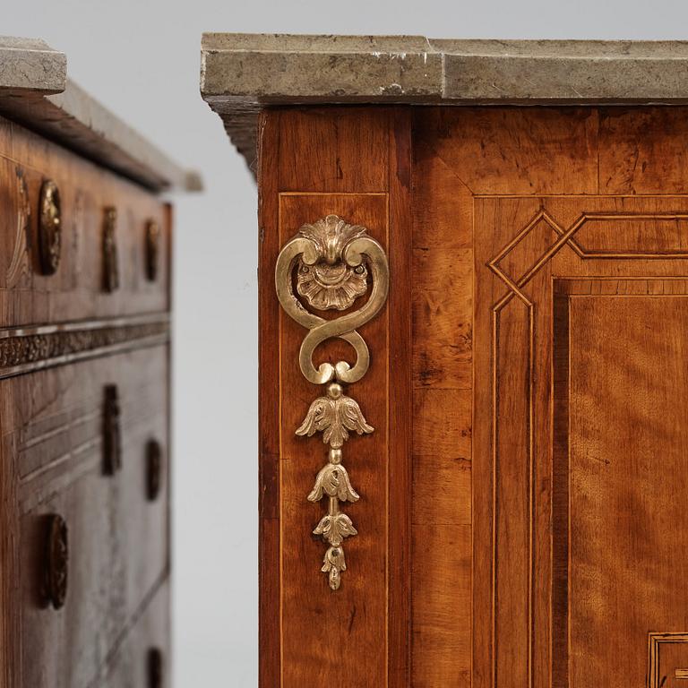 A matched pair of Gustavian ormolu-mounted limestone topped and marquetry commodes by C. Lindborg, late 18th century.