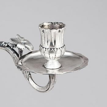A pair of Swedish 18 century silver candelabras, mark of Lars Åkerblom Gävle 1775, arms by Christian Kullberg.