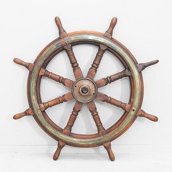 An 19th century ships stering wheel.