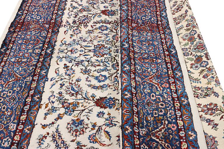 An oriental carpet with a Kerman pattern, c. 308 x 220 cm.