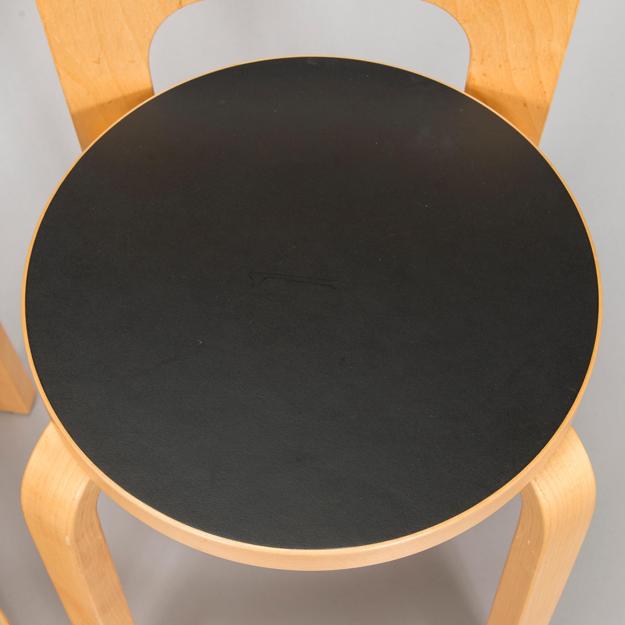 Alvar Aalto, a table and three chairs, Artek 2006 and 2007.