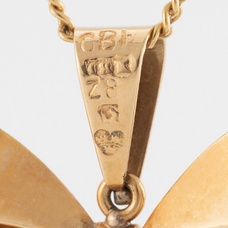 Necklace, 18K gold with synthetic white stone, in the shape of a bow.