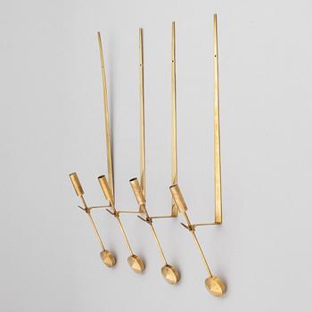 Pierre Forssell, a set of four 'Pendeln' brass wall sconces, Skultuna.