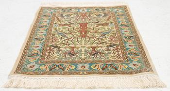 A figural silk Hereke rug, c 65 x 47 cm.