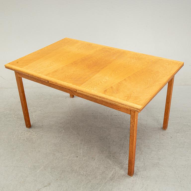 Knud Andersen, a set of six chairs for J.C.A Andersen, Aarhus, Denmark and a dinner table from Troeds, Bjärnum.