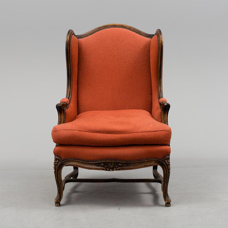A Louis XV-style armchair, about 1900.