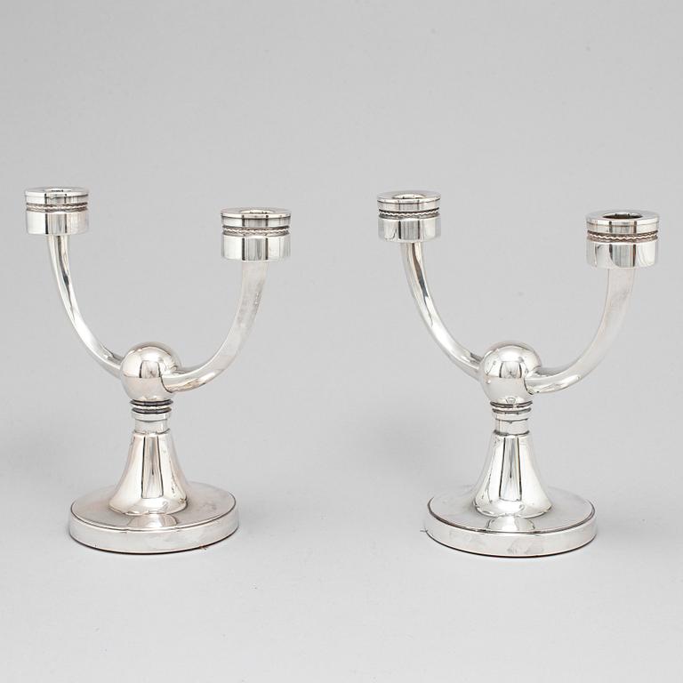 A pair of silver candelabra from MGAB, Uppsala, 1969-71.