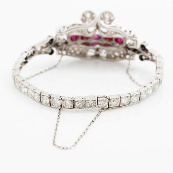 A bracelet platinum set with old- and baguette-cut diamonds and cabochon-cut rubies, circa 1930-40s.