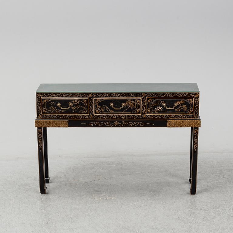 A Chinese black and gilt lacquered cupboard, 20th century.