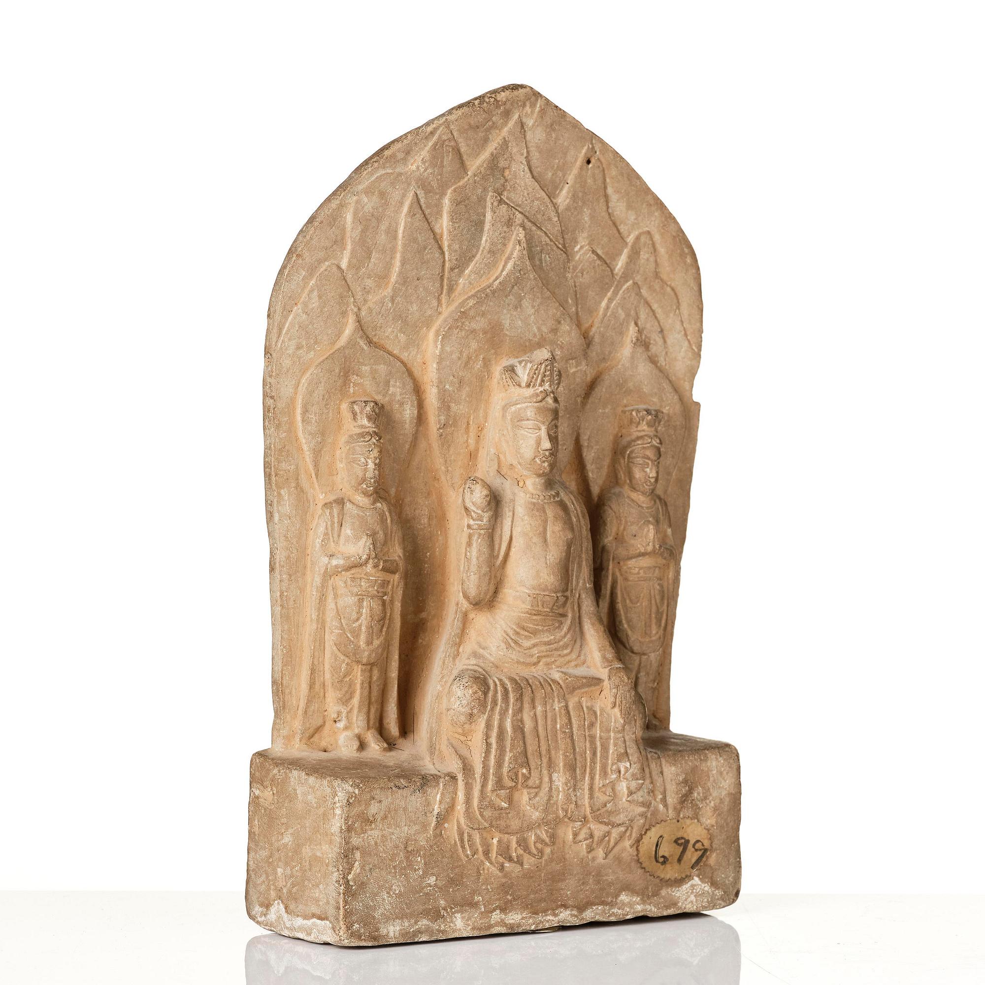 An inscribed limestone Buddhist stele, Tang style, with an inscription the third year of the Xian, corresponding to 672.