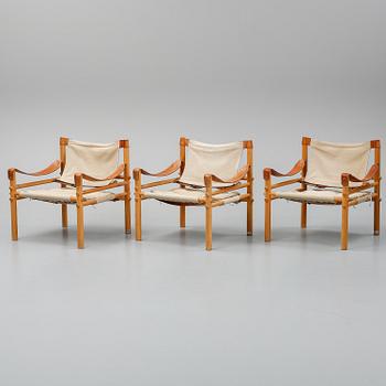 Arne Norell, a set of three "Sirocco" armchairs and two tables, Norell.