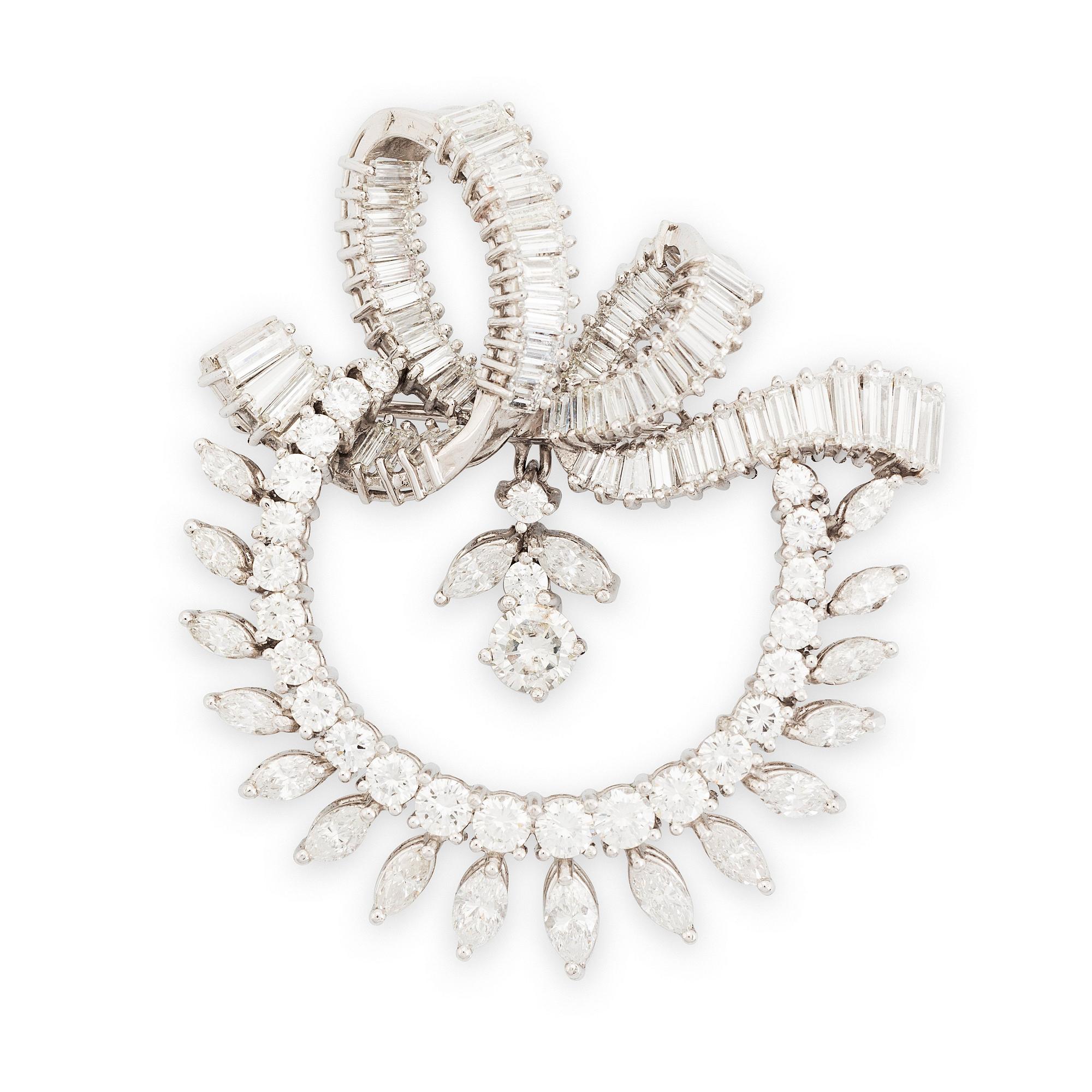 A platinum brooch set with navette-, tapered baguette- and brilliant-cut diamonds.