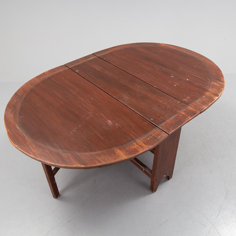 A 19th century painted flap table.