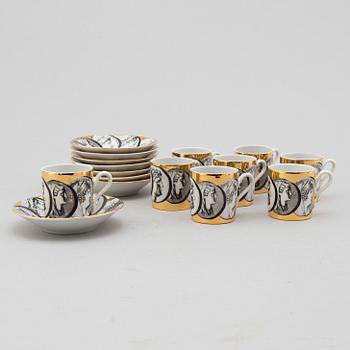 FORNASETTI, eight porcelian espresso cups and saucers from Milan, Italy.