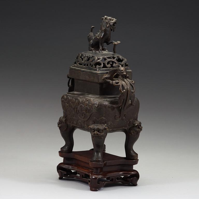 A Chinese bronze incense burner with pierced cover, Qing dynasty, 17th/18th century.