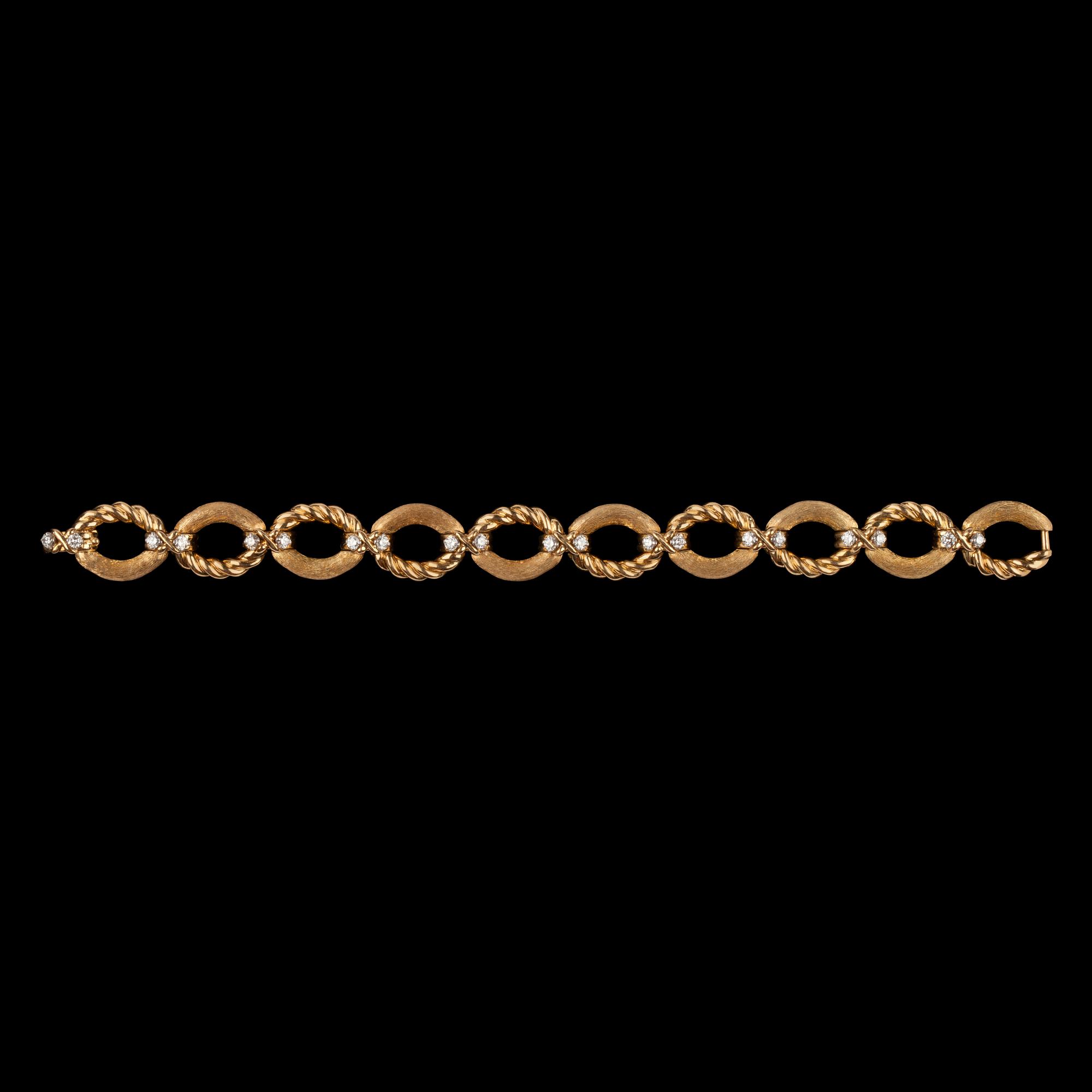 ARMBAND, Tiffany, guld med briljantslipade diamanter, tot. 1.20 ct.