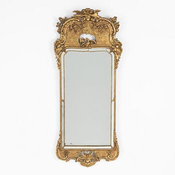 A giltwood rococo mirror, later part of the 18th century.