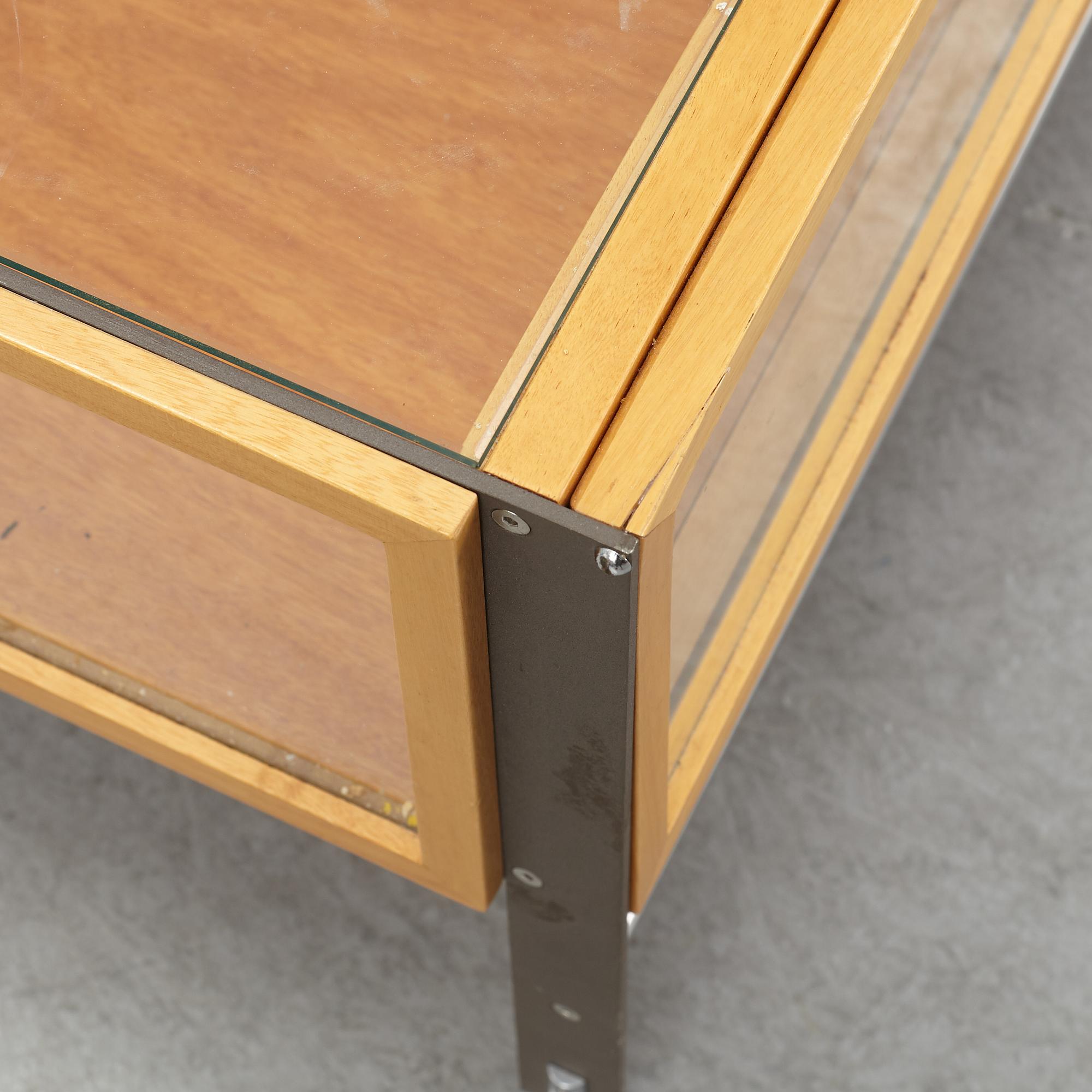 A glass top coffee table, late 20th Century.