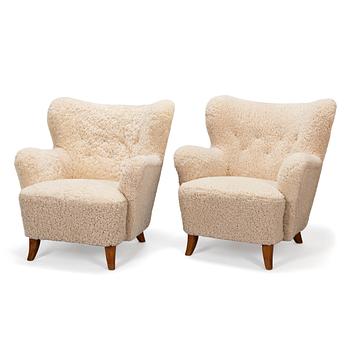 A pair of mid-20th-century armchairs.