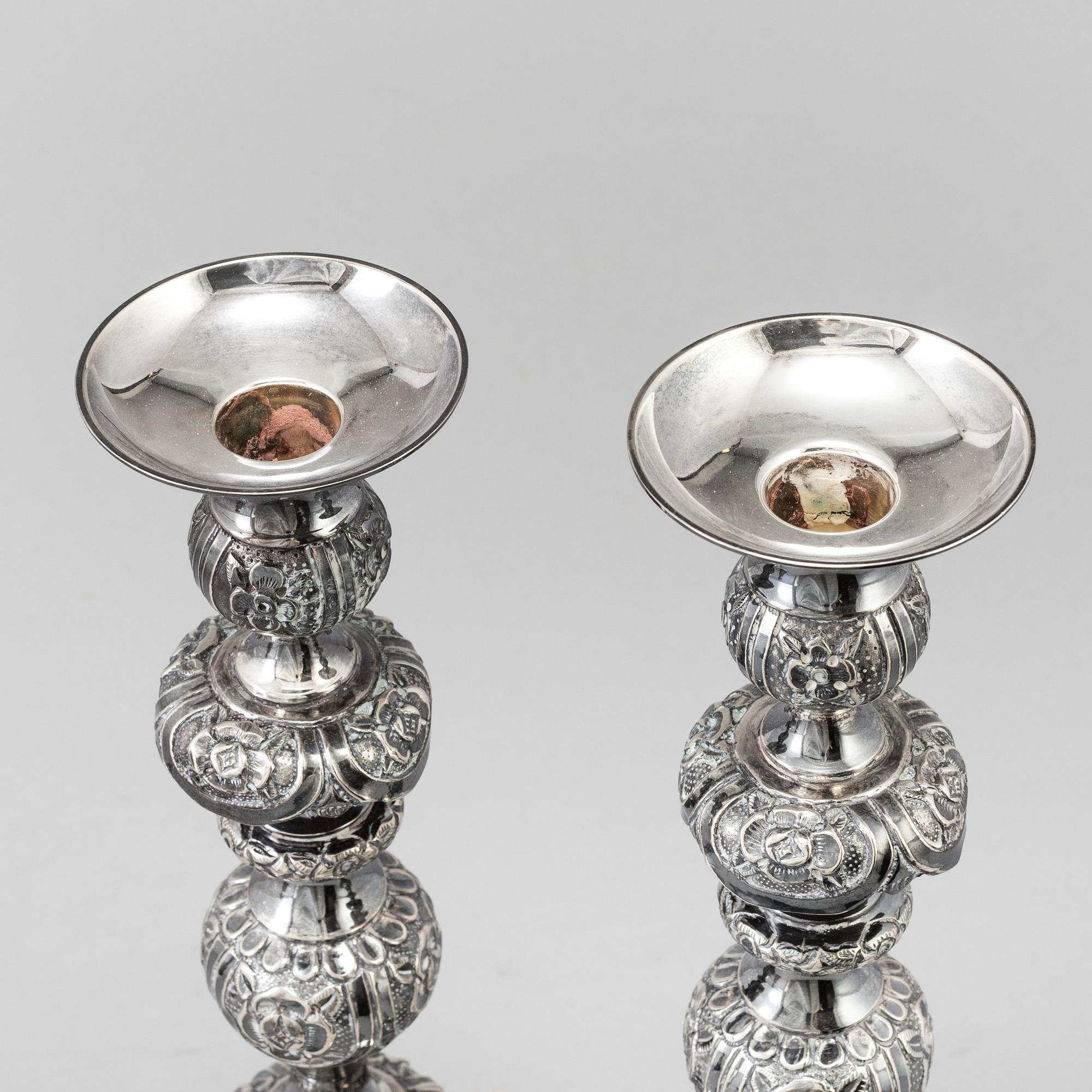 A pair of silver Sabbath candlesticks, Maker M. Sztern, Warsaw, Poland. Assayer Josef Sosnkowski, 1864. Weight 833 g.
