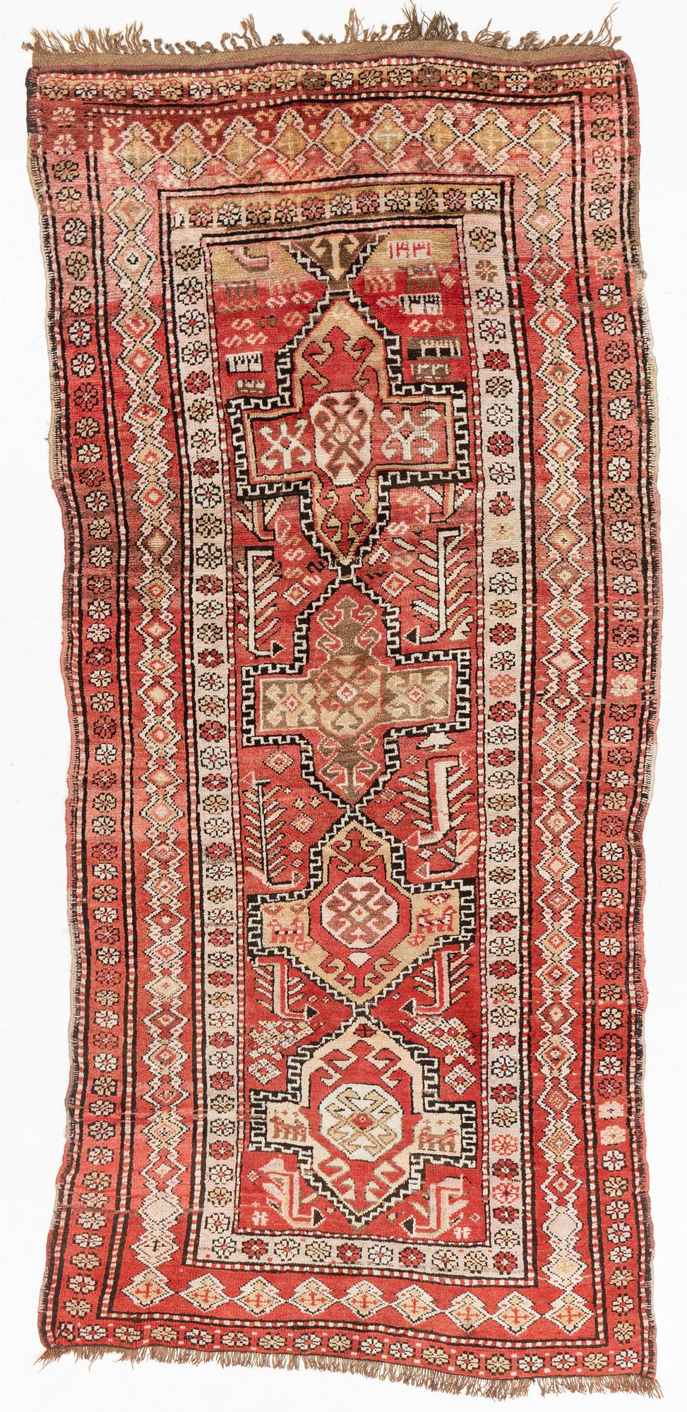 An oriental semi antique carpet, circa 272 x 120 cm.