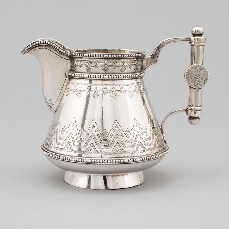 A Russian 19th century parcel-gilt silver tea pot and cream jug, mark possbly of Alexander Lokin, St. Petersburg 1893.
