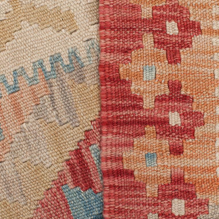 A kilim runner, around 300 x 85 cm.